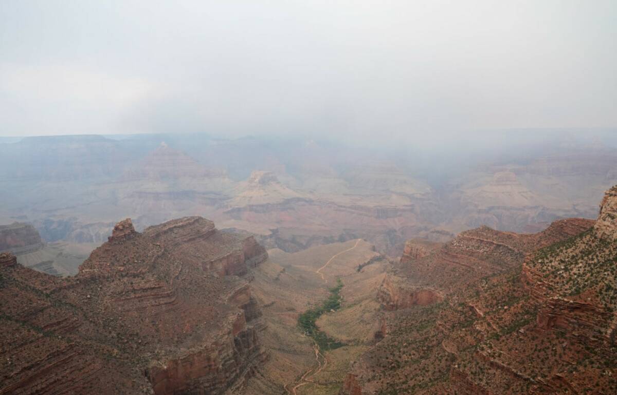 Smoke from the Dragon Bravo Fire moves over the Grand Canyon from the North Rim, Monday, July 1 ...