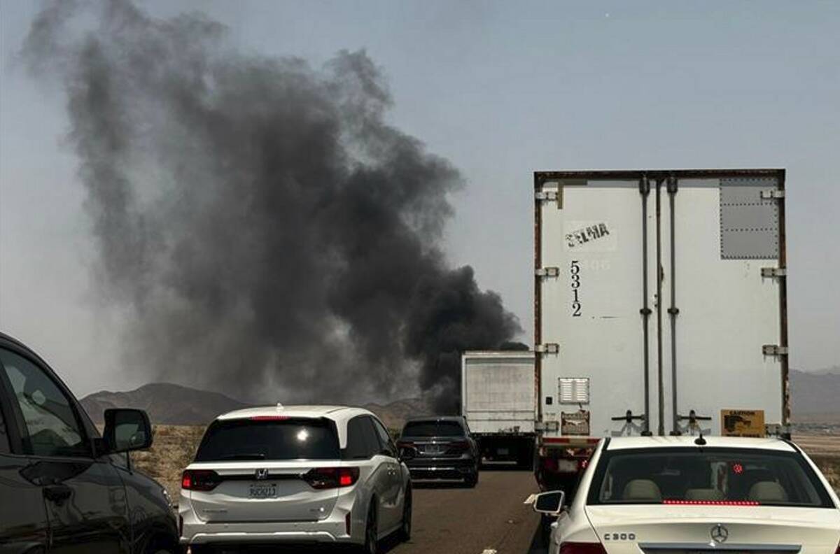 A fire shut down the northbound lanes of Interstate 15 near Baker, Calif., on Monday, July 14, ...