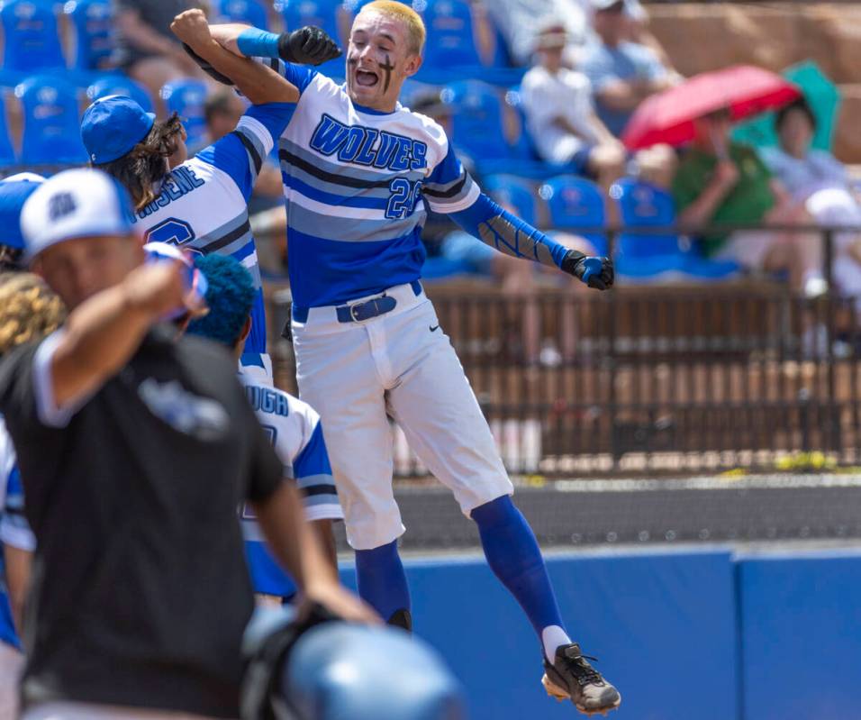 Basic batter Mason Neville (26) celebrates another score versus Bishop Manogue during their Cla ...