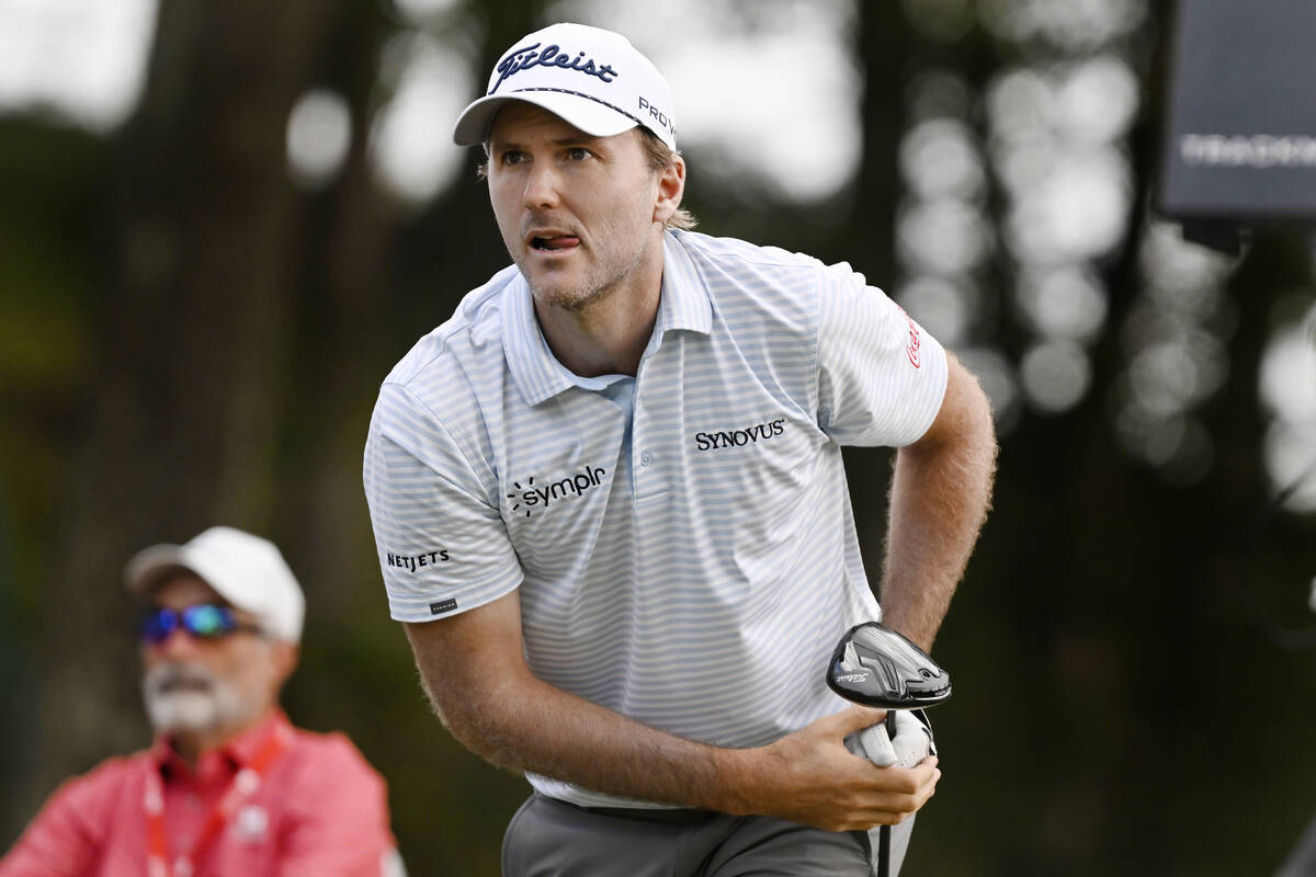 Russell Henley watches his tee shot on the 18th hole during the third round of the Travelers Ch ...