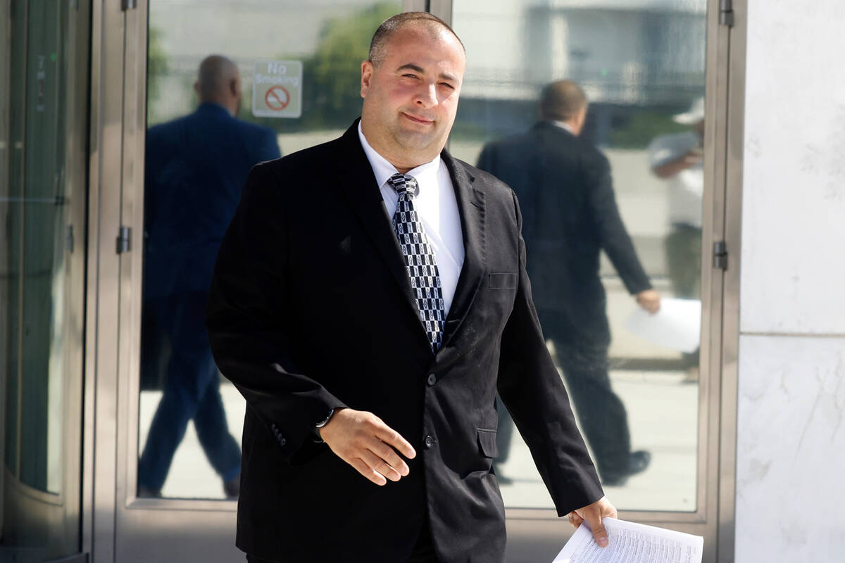A former captain with the Nye County Sheriff's Office, David Boruchowitz, leaves the Lloyd Geor ...