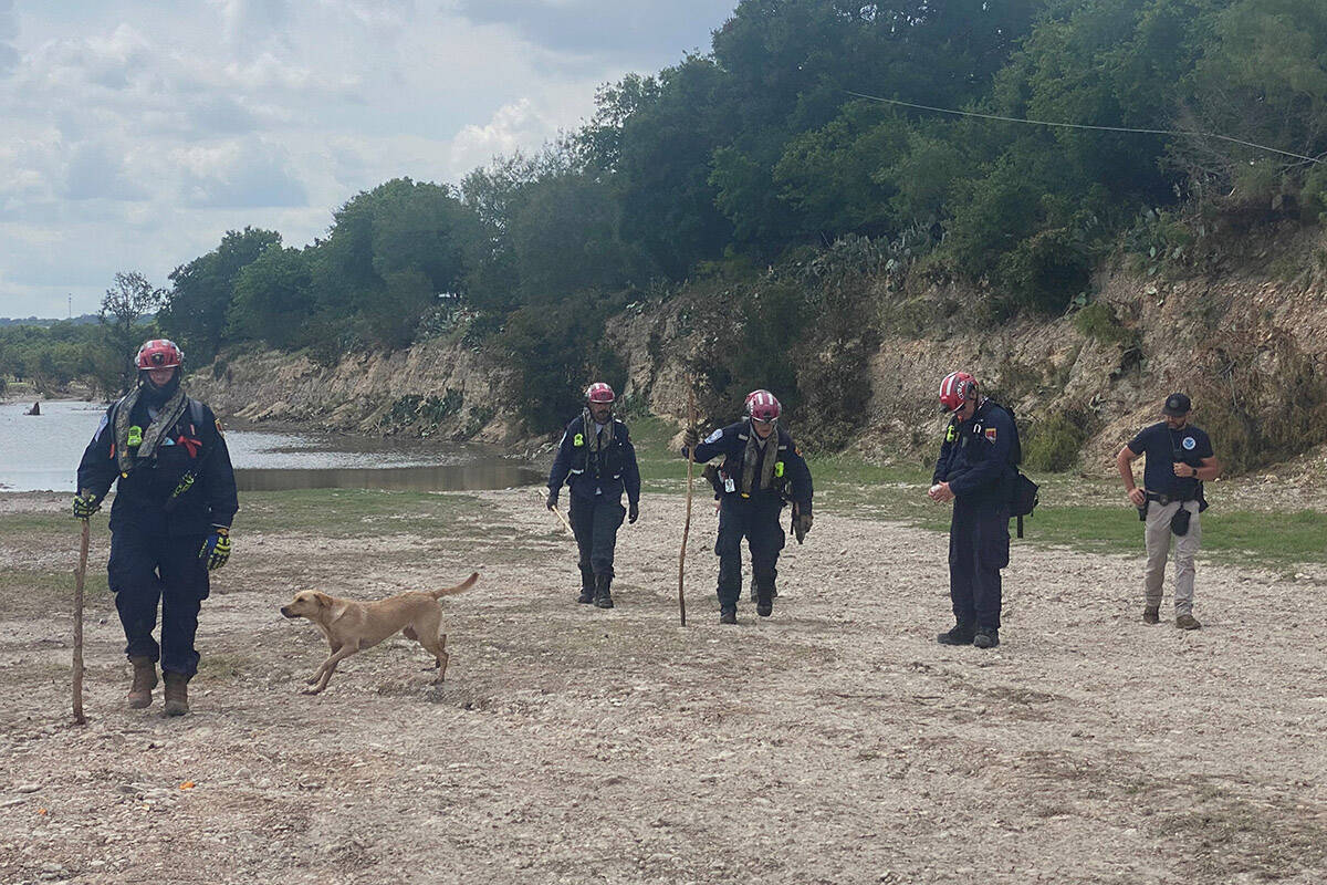 Nevada Task Force-1 members return to the camp after finishing their search activities for the ...