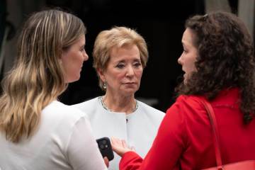 Education Secretary Linda McMahon, talks to her staff as they wait on the North Lawn of the Whi ...