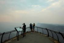 Smoke from the Dragon Bravo Fire moves over the Grand Canyon from the North Rim blocking the vi ...
