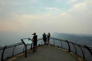 Smoke from the Dragon Bravo Fire moves over the Grand Canyon from the North Rim blocking the vi ...