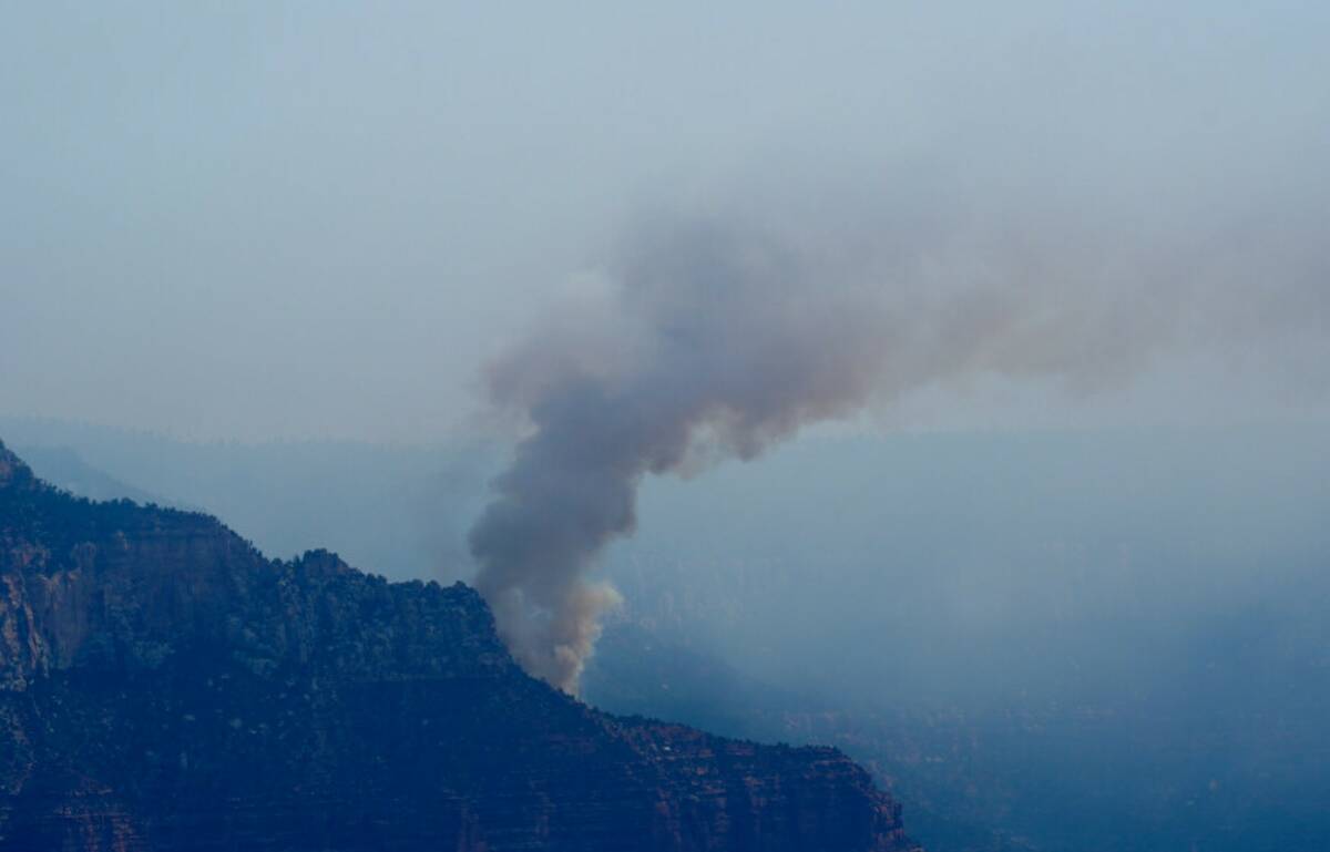 Smoke from the Dragon Bravo Fire moves over the Grand Canyon along the North Rim Tuesday, July ...