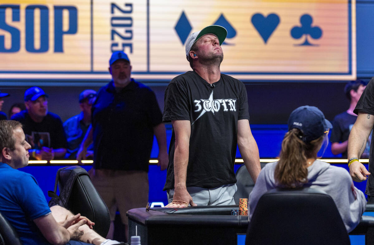 Braxton Dunaway of Midland, Texas, can't look as the cards are turned on the final table during ...