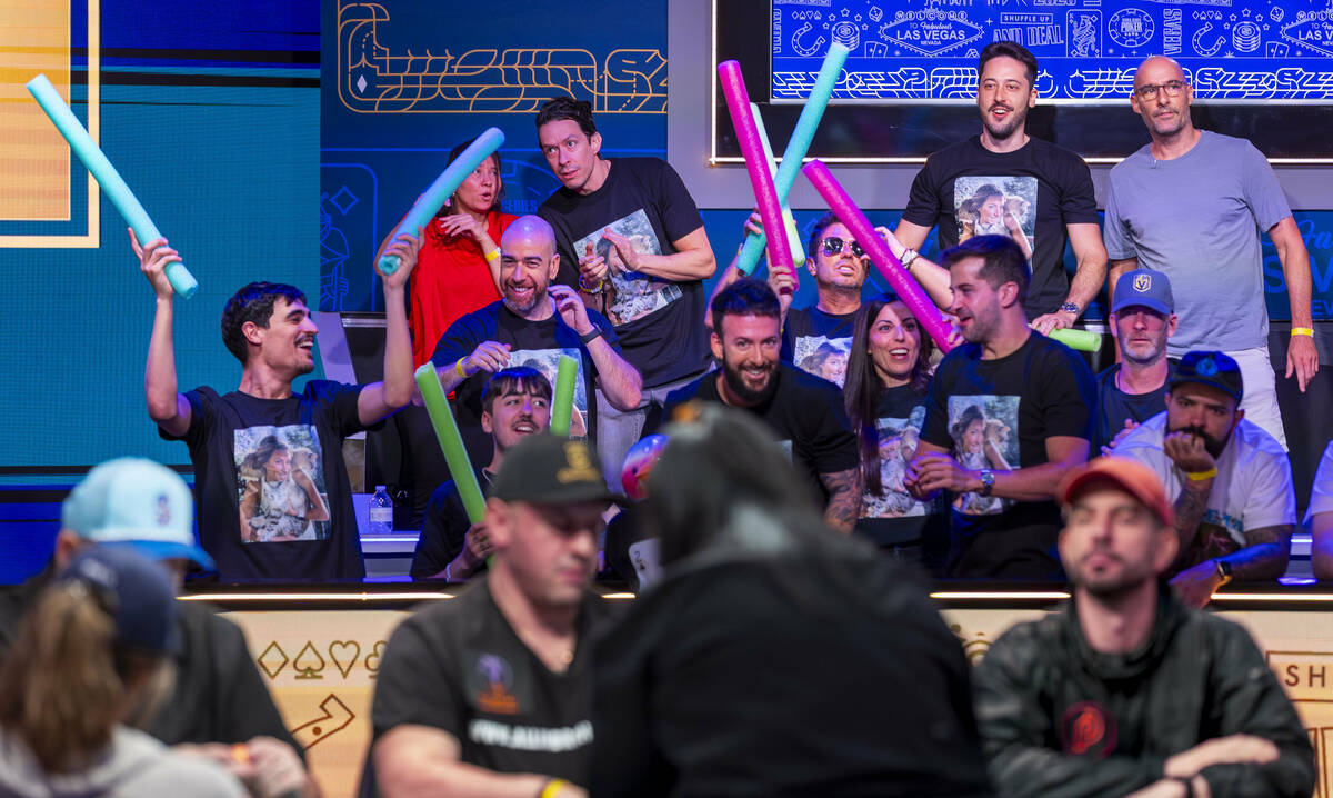 Supporters of Leo Margets of Spain, cheer her on at the final table during the World Series of ...