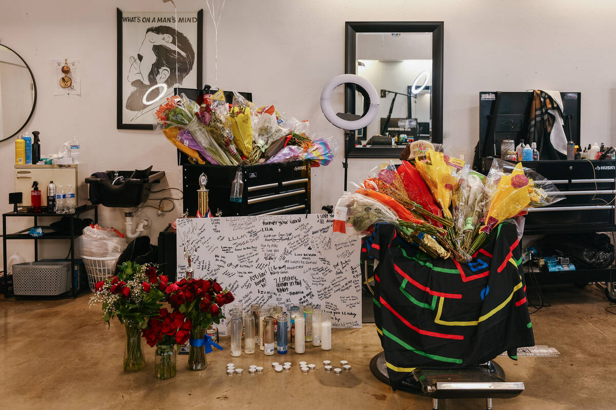 Loved ones set up a memorial at Michael Simmons’ chair at Faded Barbershop on Tuesday, J ...