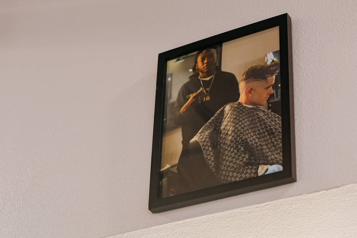 A photo of Michael Simmons sits above his barber station on Tuesday, July 15, 2025 in North Las ...