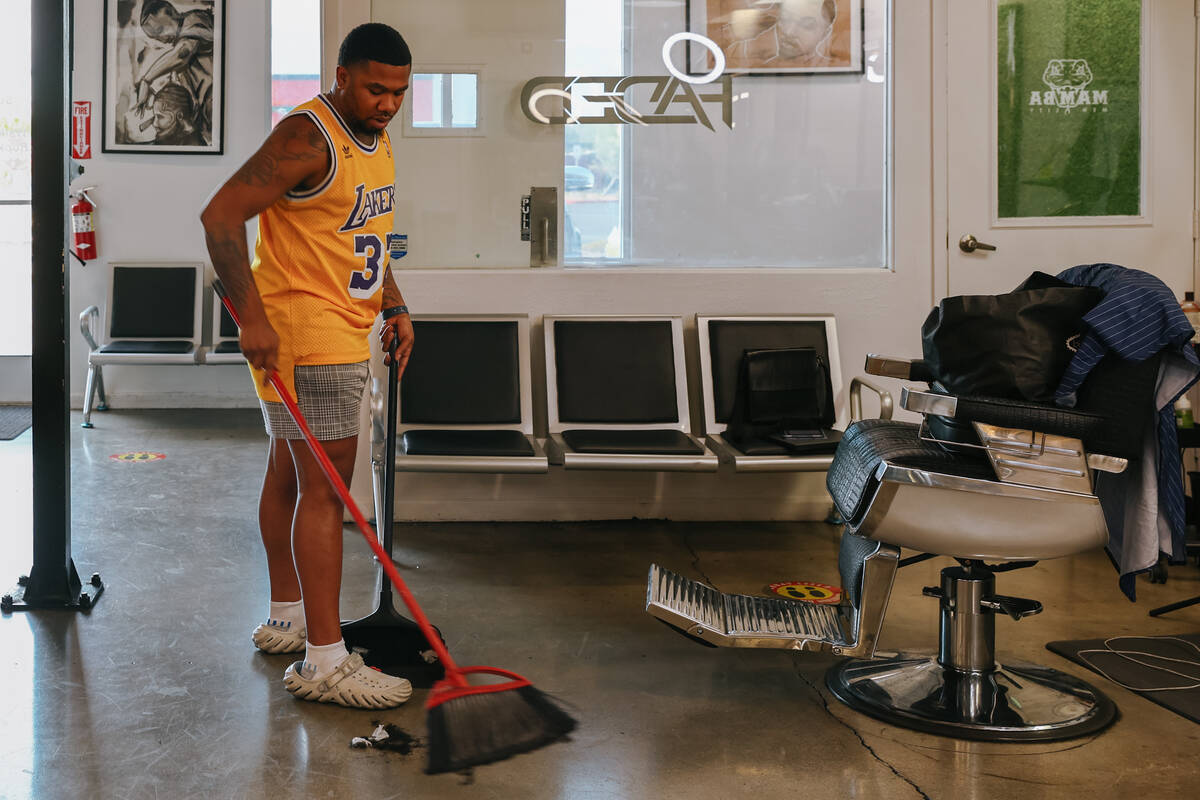 DeMario Jackson sweeps up hair at Faded Barber Shop on Tuesday, July 15, 2025 in North Las Vega ...