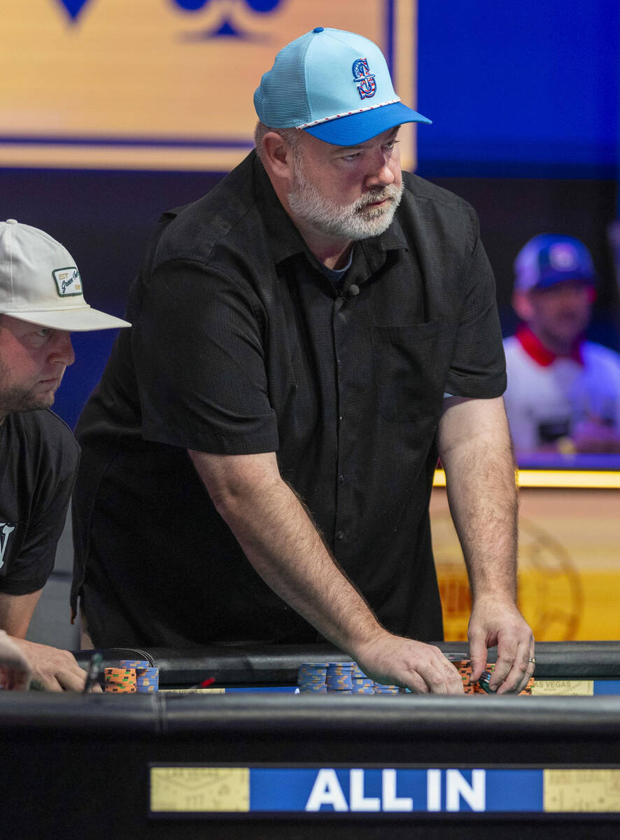 John Wasnock of North Bend, Washington, collects some chips on the final table during the World ...