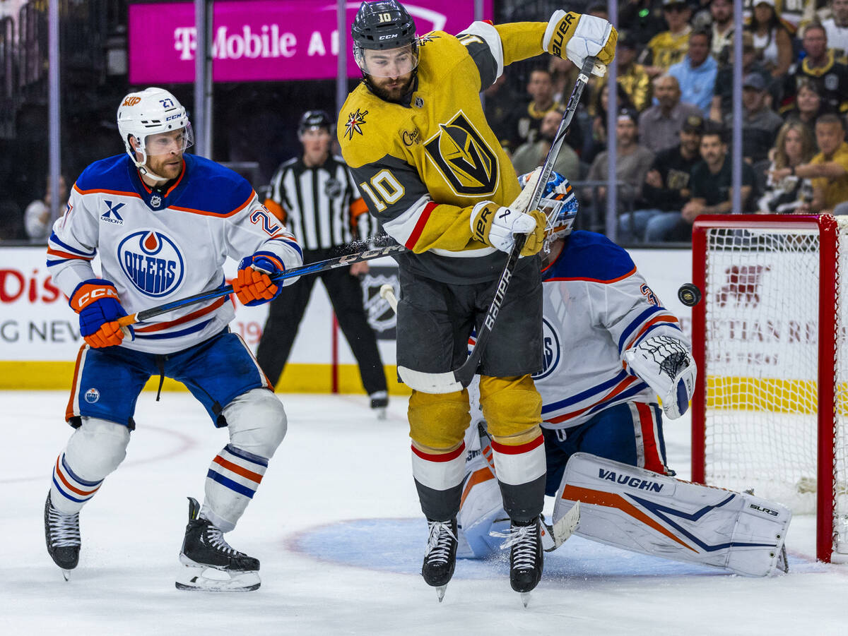 Golden Knights center Nicolas Roy (10) deflects a shot at the net and nearly wins the game past ...
