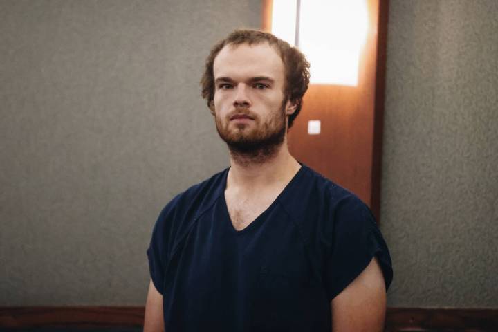 Spencer McDonald, charged with three counts murder and one count of attempted murder, stands in ...