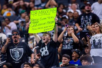 A Raiders fan wants to invite defensive end Maxx Crosby (98) to his graduation during an open p ...