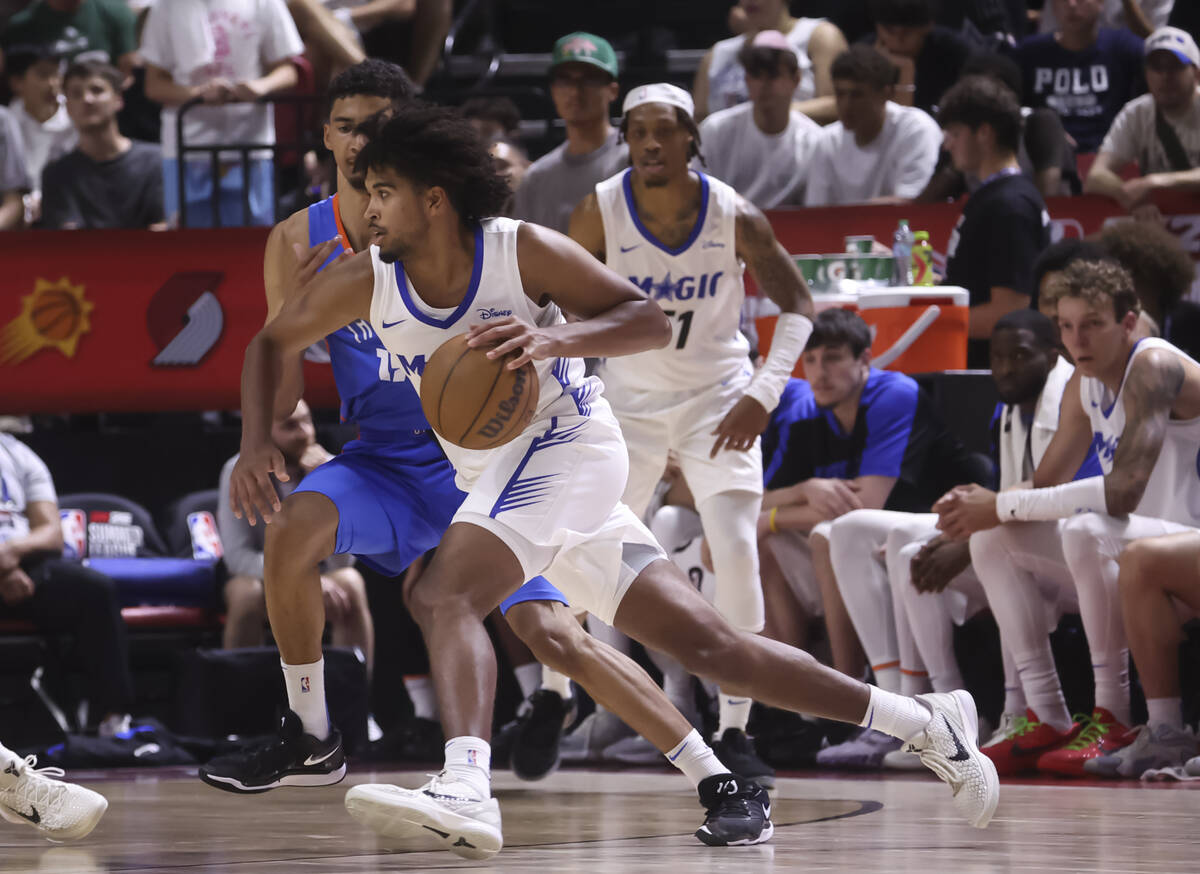 Orlando Magic guard Ethan Thompson (55) drives the ball against the Oklahoma City Thunder durin ...