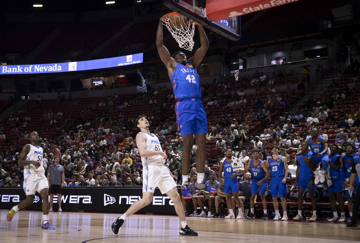 Oklahoma City Thunder center Mady Sissoko (42) dunks the ball against Orlando Magic forward Zac ...