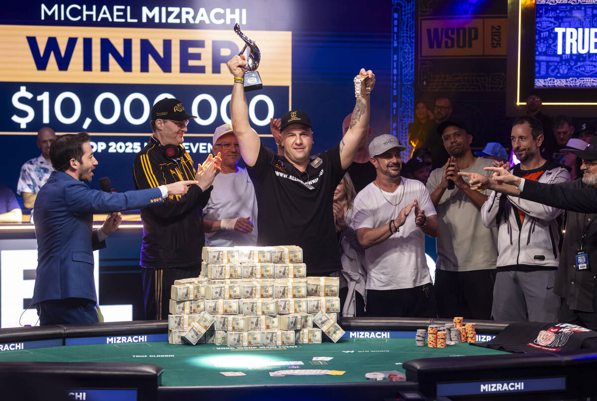 Michael Mizrachi, center, celebrates as Poker Hall of Fame members congratulate him following h ...
