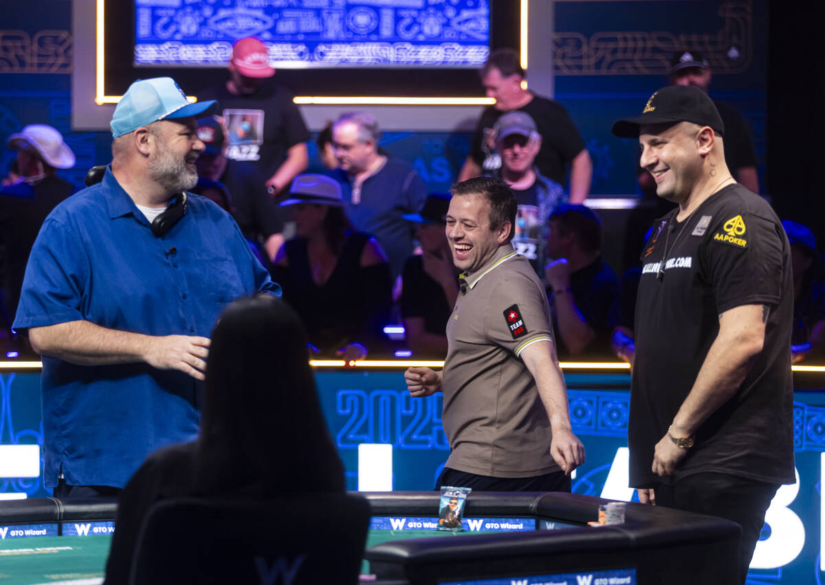 Kenny Hallaert, center, shares a laugh with Michael Mizrachi, left, and John Wasnock as they pr ...