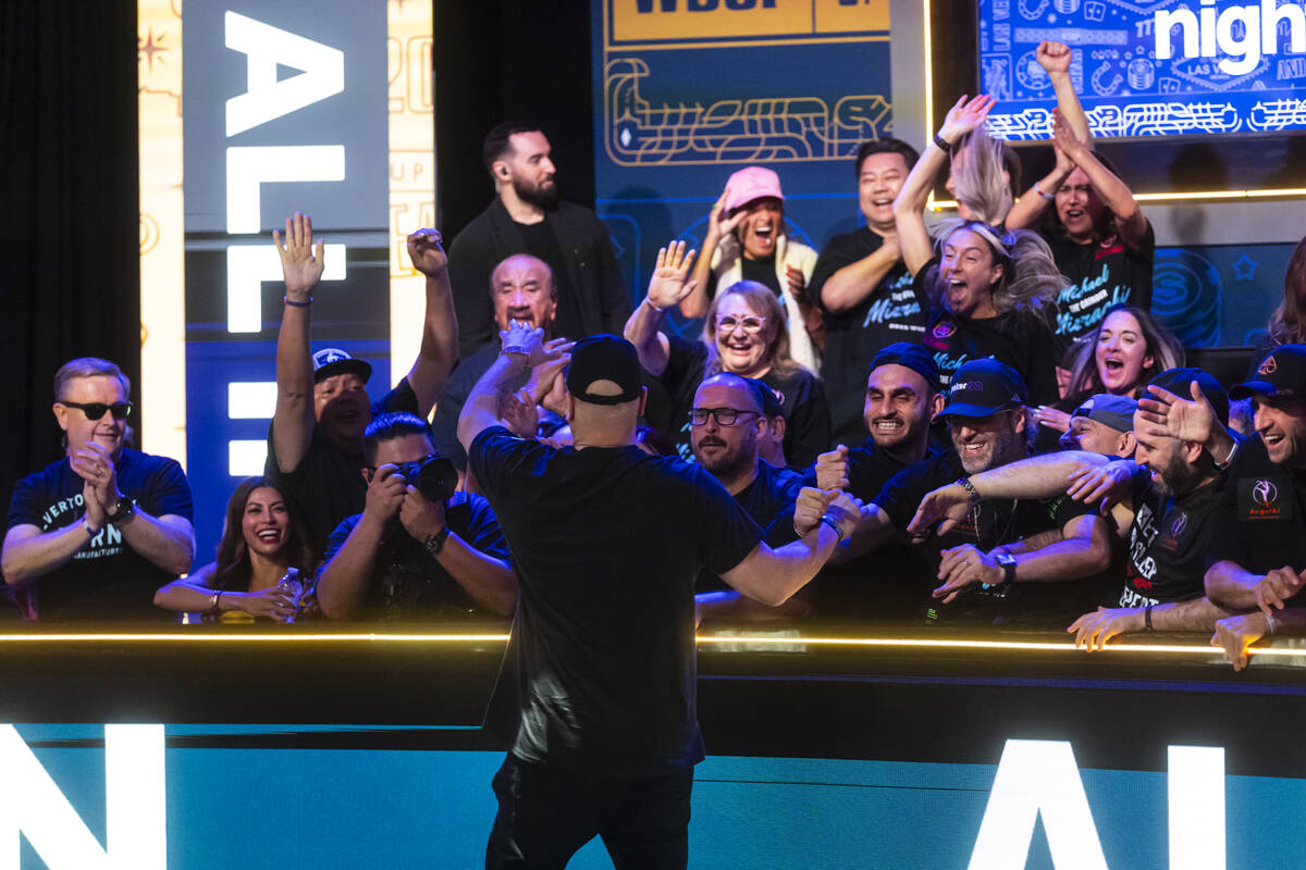 Michael Mizrachi celebrates with supporters after knocking out Braxton Dunaway, not pictured, a ...