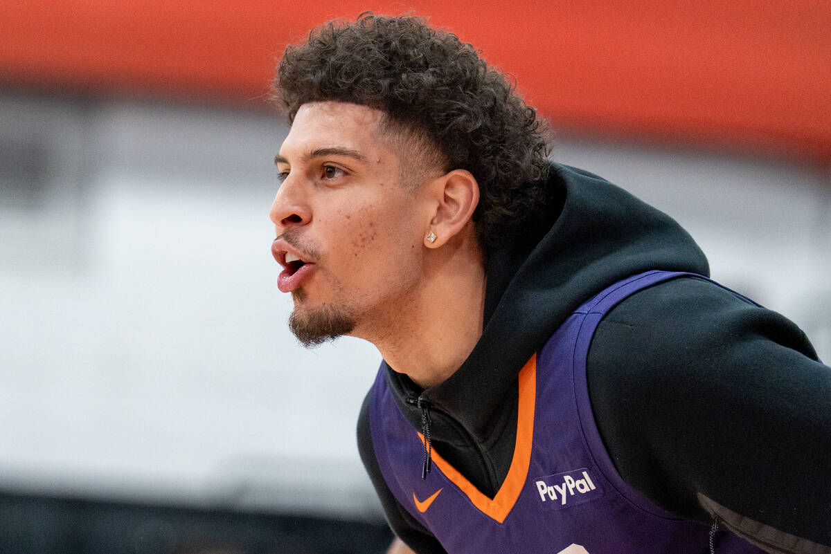 Phoenix Suns’ Koby Brea (14) cheers from the bench during an NBA Summer League game at C ...