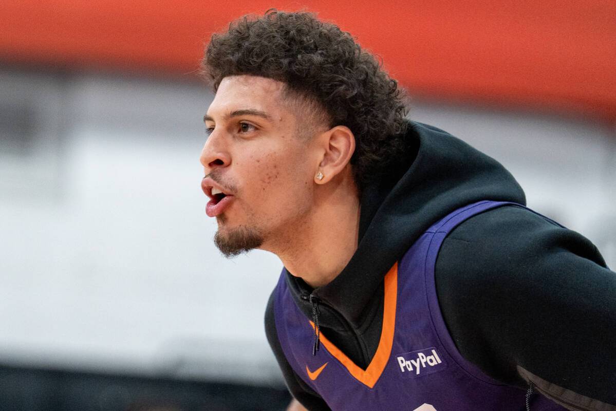 Phoenix Suns’ Koby Brea (14) cheers from the bench during an NBA Summer League game at C ...