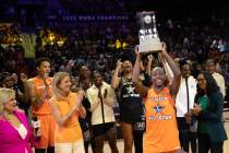 The Seattle Storm’s Jewell Loyd, of Team Stewart, holds up her MVP trophy after the WNBA ...