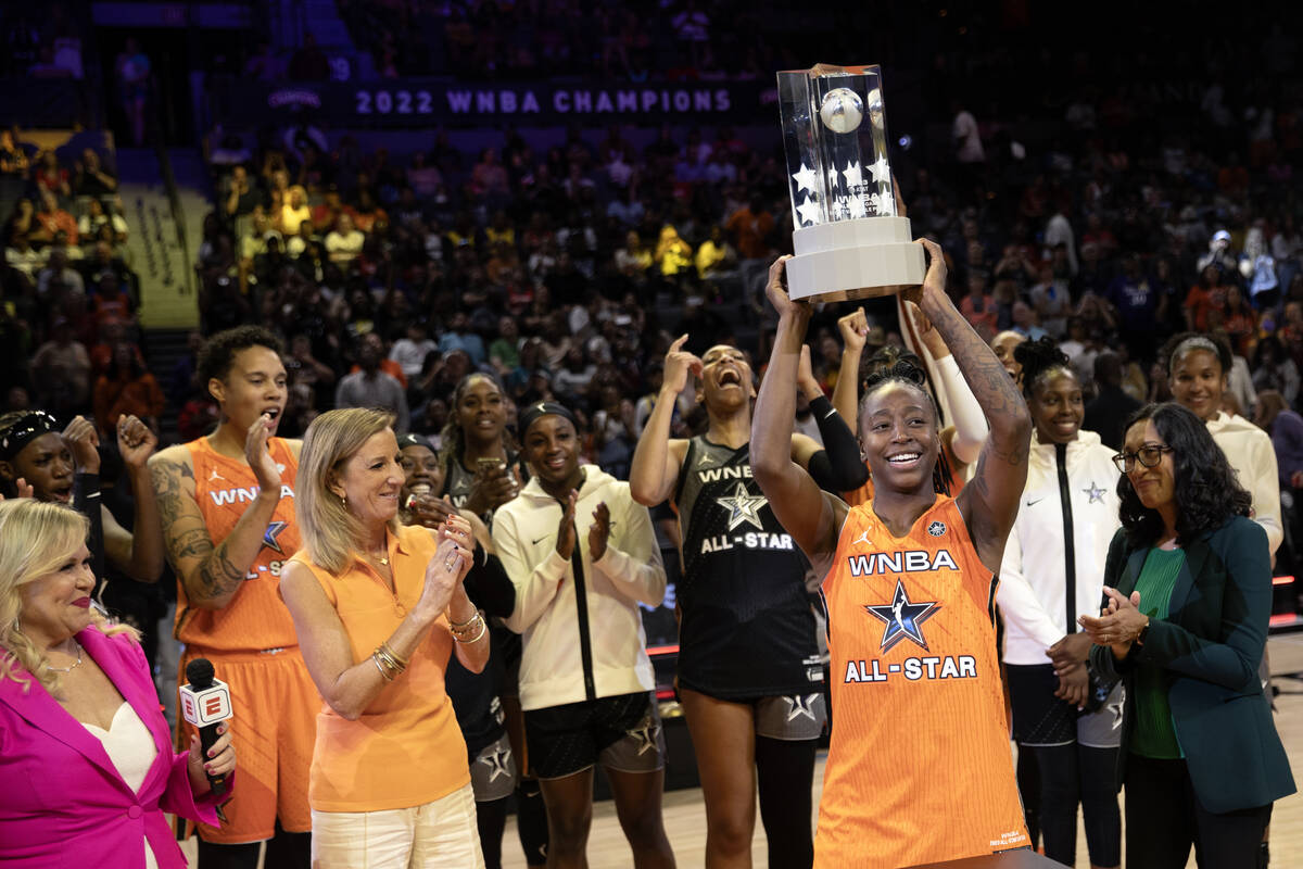 The Seattle Storm’s Jewell Loyd, of Team Stewart, holds up her MVP trophy after the WNBA ...
