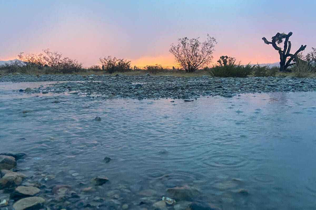 Puddles of water at Paiute Way and Interstate 95 on Thursday. (Bryan Horwath/Las Vegas Review-J ...
