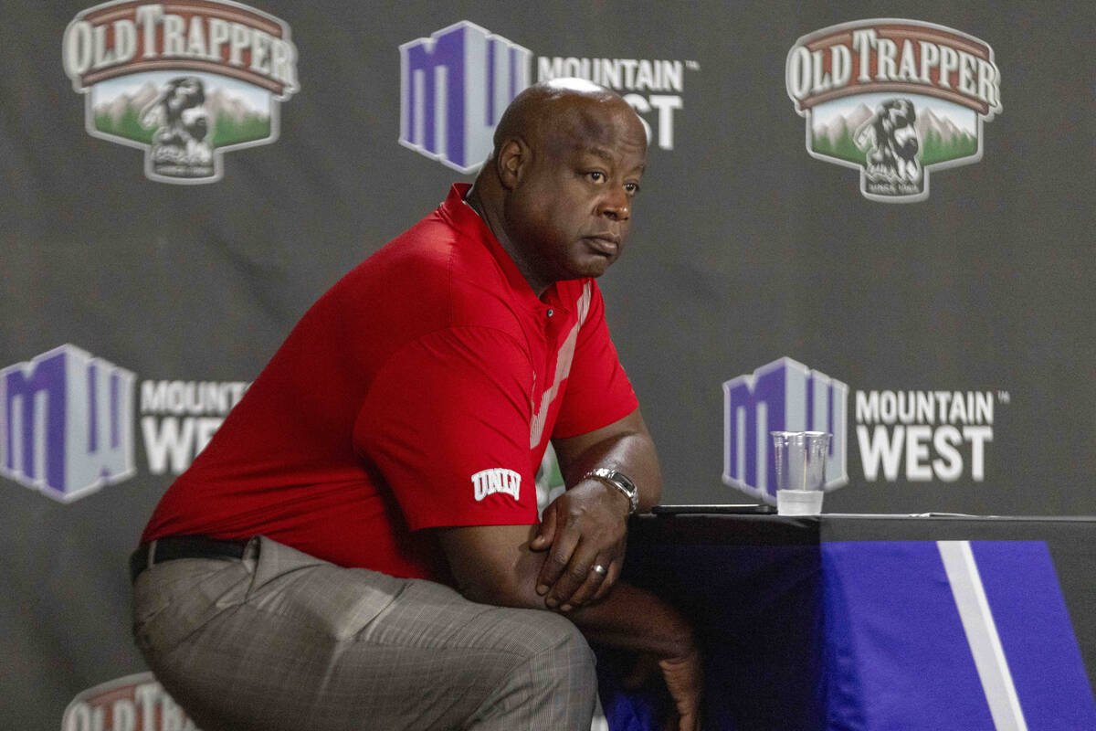 UNLV athletic director Erick Harper watches news conferences take place during Mountain West Me ...