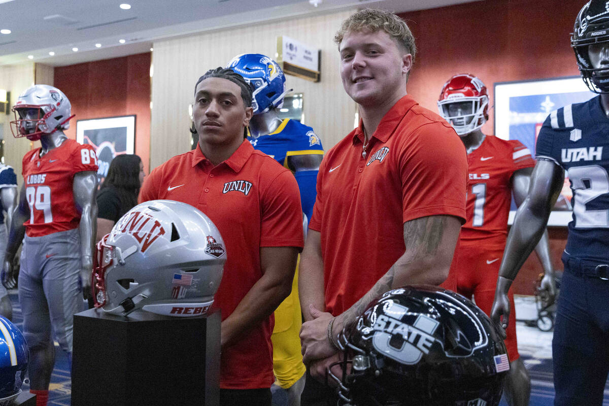 UNLV football wide receiver DeAngelo Irvin Jr., left, and safety Jake Pope pose for a photo dur ...