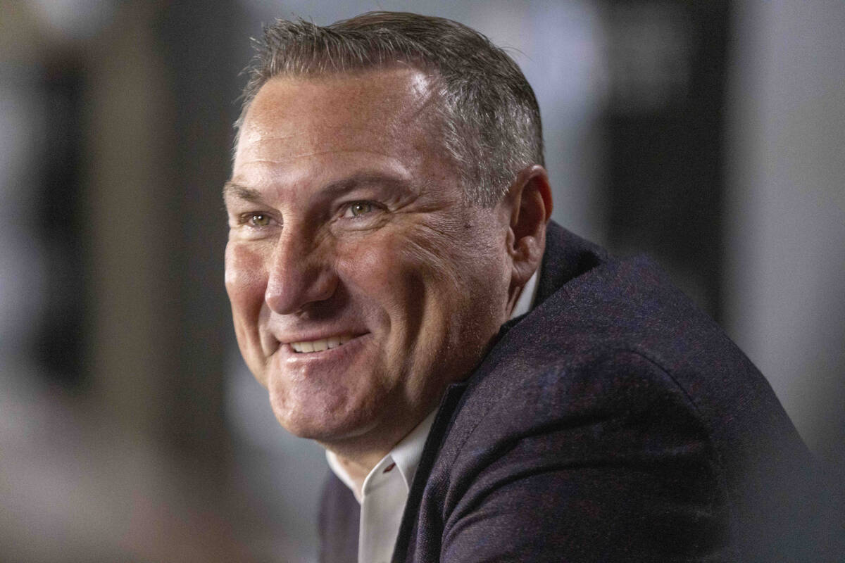 UNLV football head coach Dan Mullen smiles as he takes questions at a news conference during Mo ...