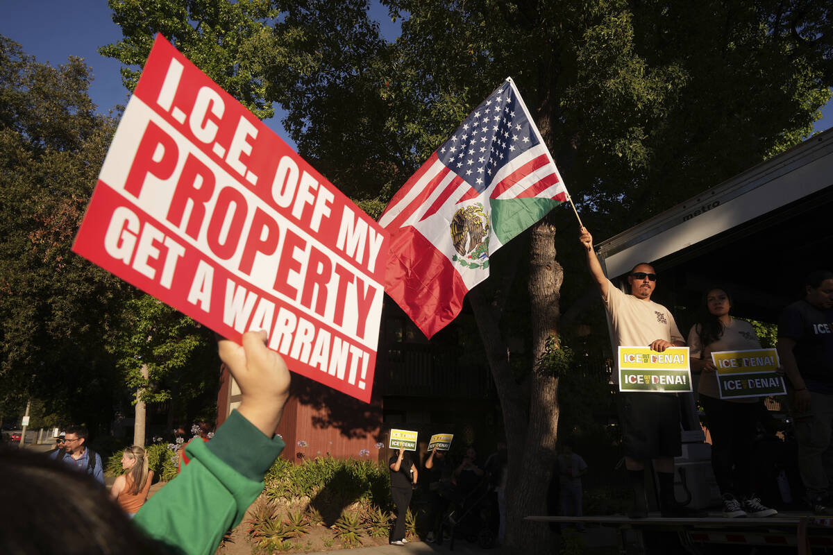 Residents gather during a community vigil on Monday, June 30, 2025, to stand in solidarity with ...