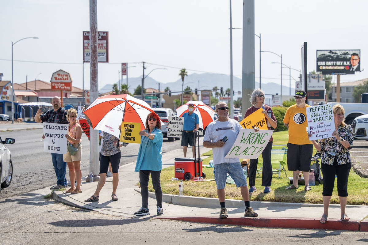 Protesters shout at departing guests after the Campus for Hope groundbreaking in Las Vegas July ...