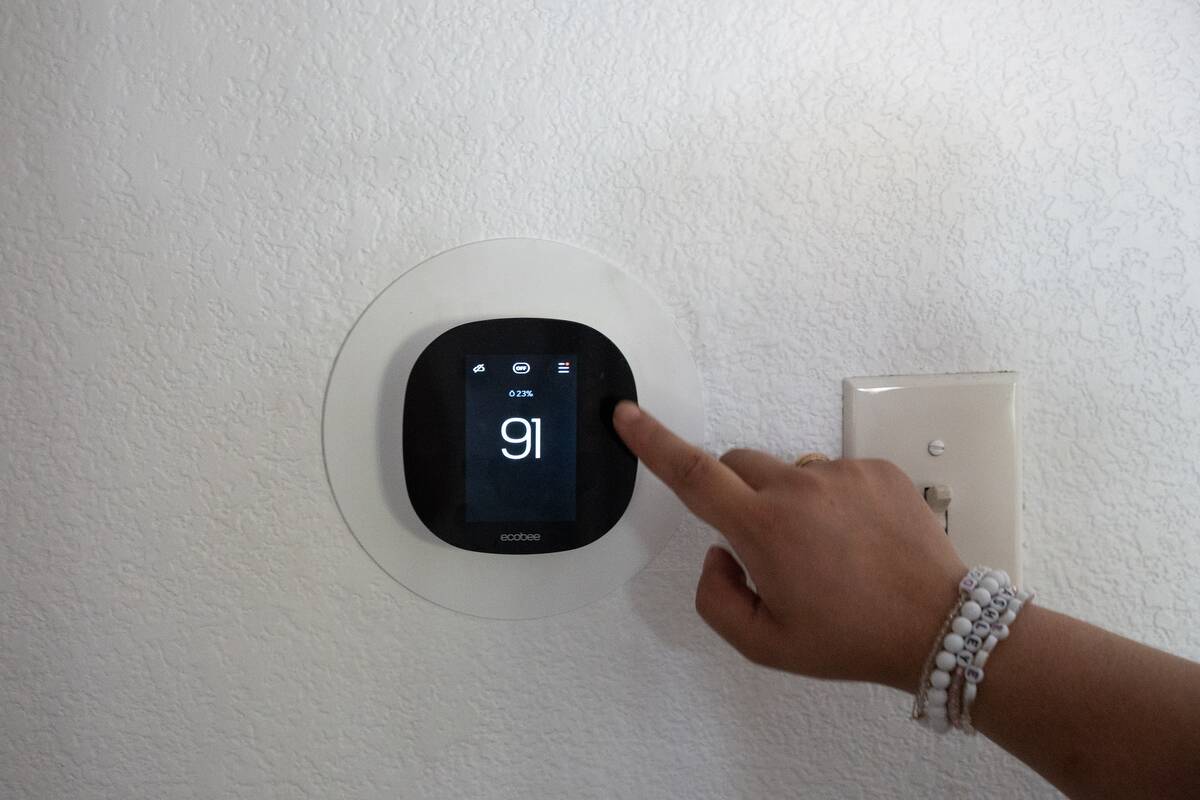 The thermostat reads 91 degrees Ashley Webster’s Las Vegas apartment Tuesday morning Jul ...