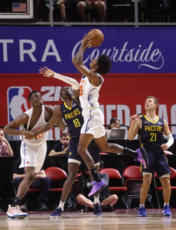 New York Knicks guard Dink Pate (28) shoots against Indiana Pacers center Samson Johnson (18) d ...