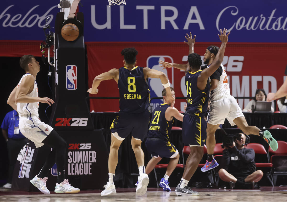 New York Knicks guard Biwali Bayles (27) passes the ball through Indiana Pacers traffic during ...
