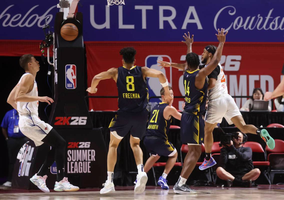New York Knicks guard Biwali Bayles (27) passes the ball through Indiana Pacers traffic during ...