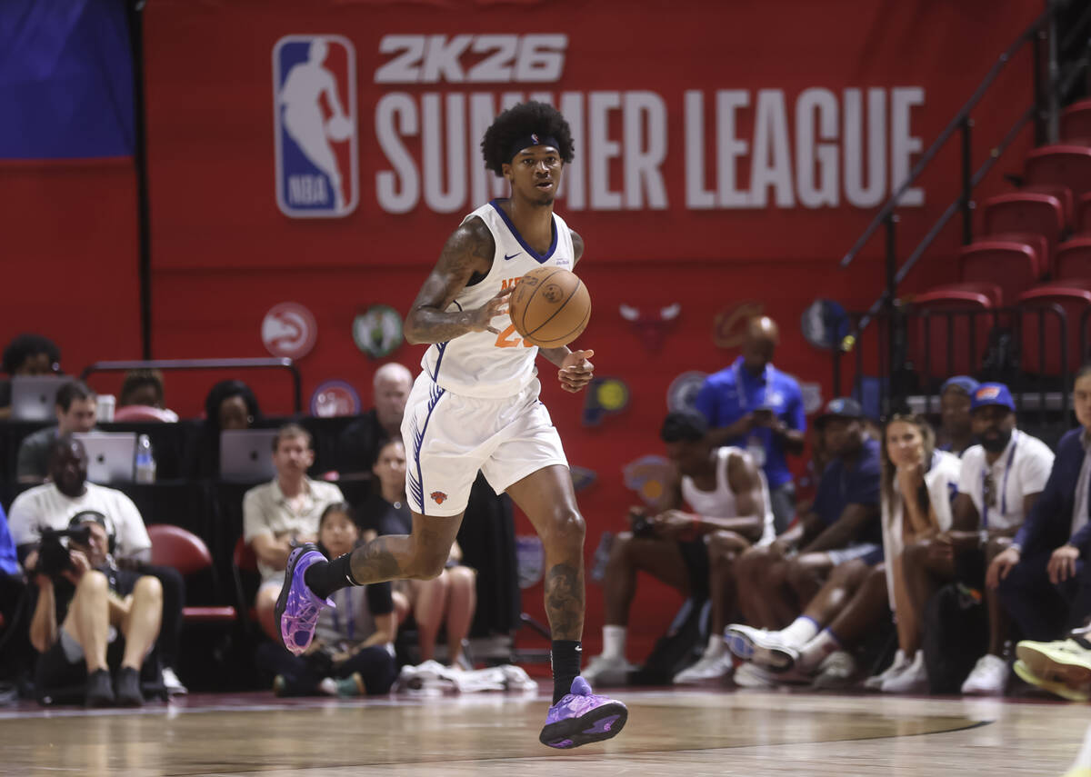 New York Knicks guard Dink Pate (28) brings the ball up court during an NBA Summer League baske ...