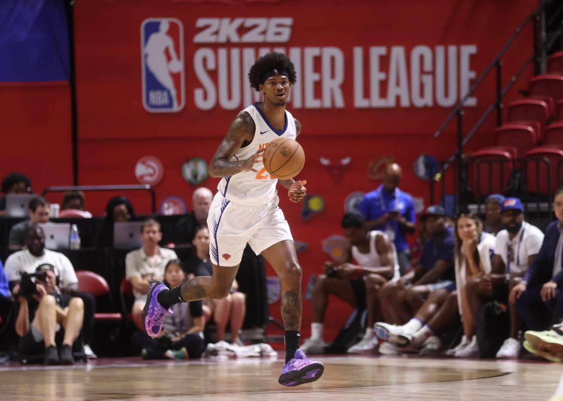 New York Knicks guard Dink Pate (28) brings the ball up court during an NBA Summer League baske ...