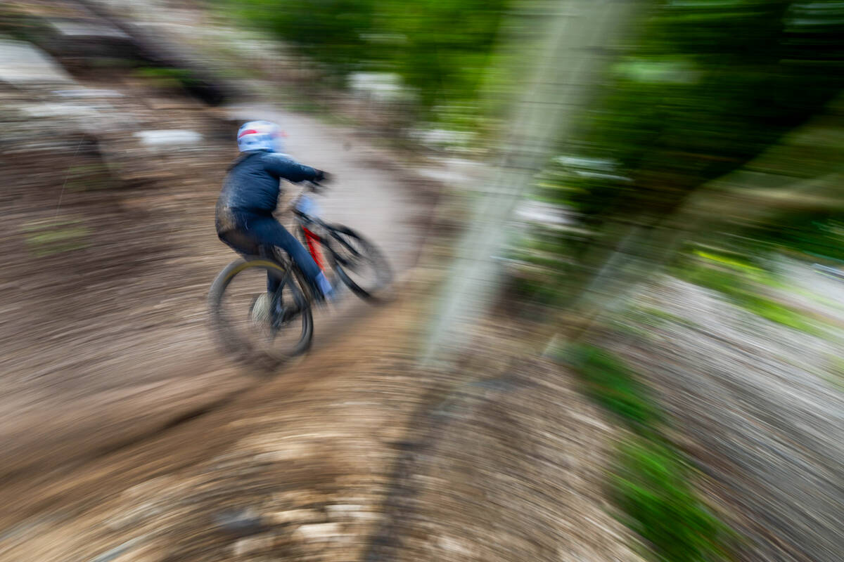 A women’s open competitor navigates a high-banked turn during the Viva La Gravity at the Lee ...