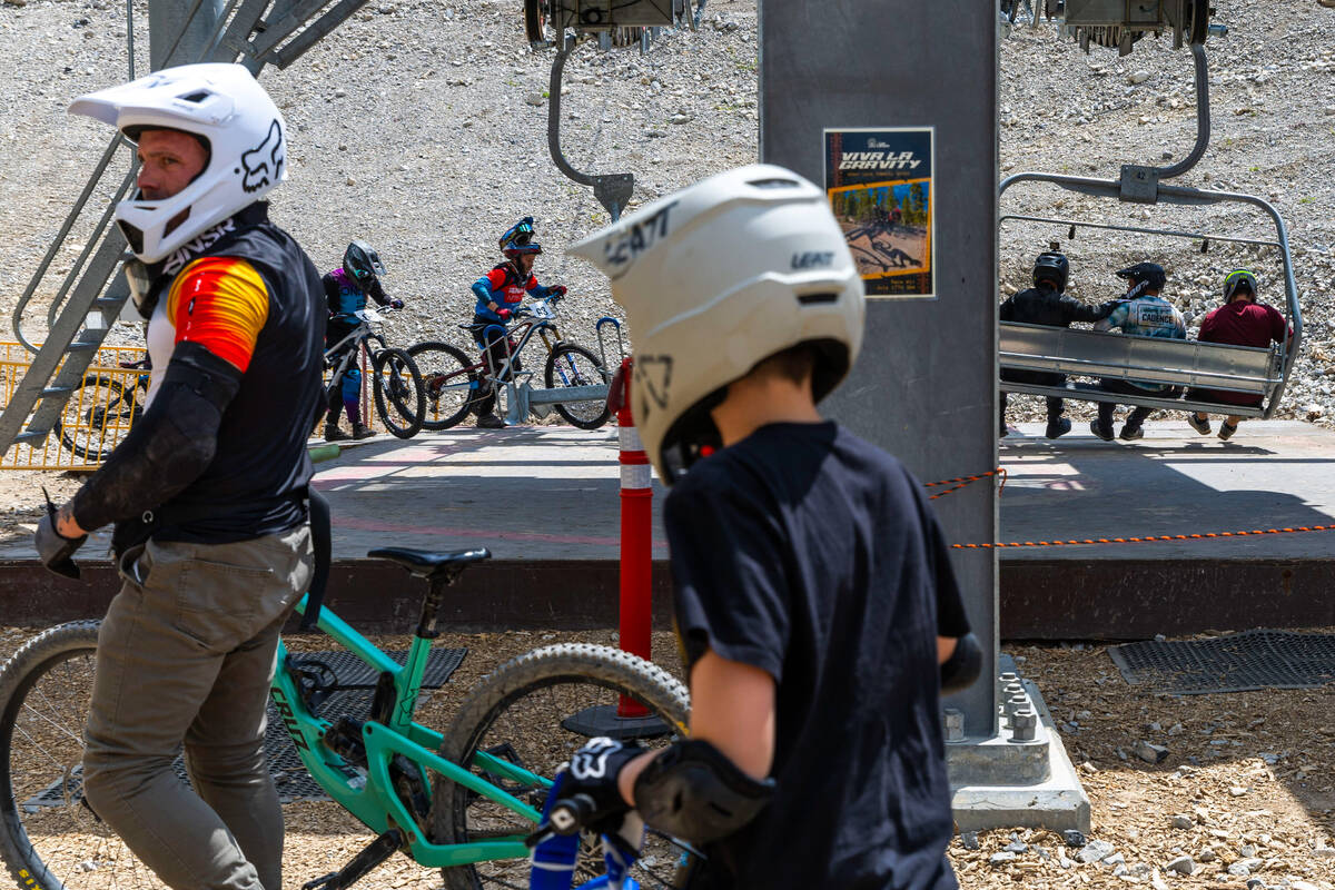 Competitors load up their bikes and themselves on a chair lift to the start during the Viva La ...