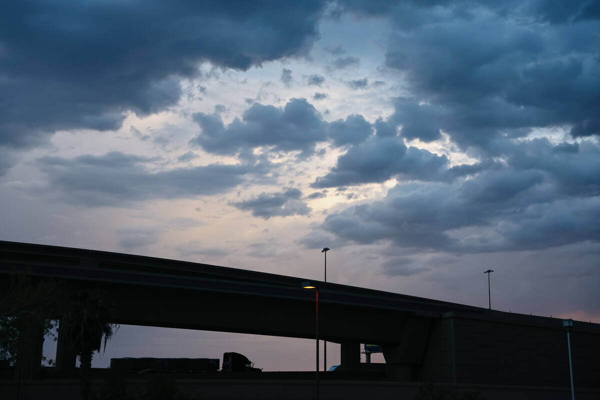 Clouds form over Interstate 15 near downtown Las Vegas as the sun sets on Thursday, July 17, 20 ...