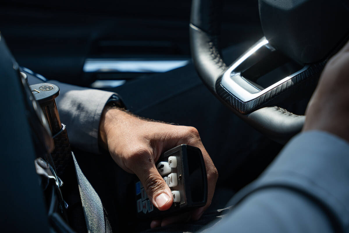 Luis Villanueva, a sworn recruiter with the Nevada Highway Patrol, uses a radar system to check ...