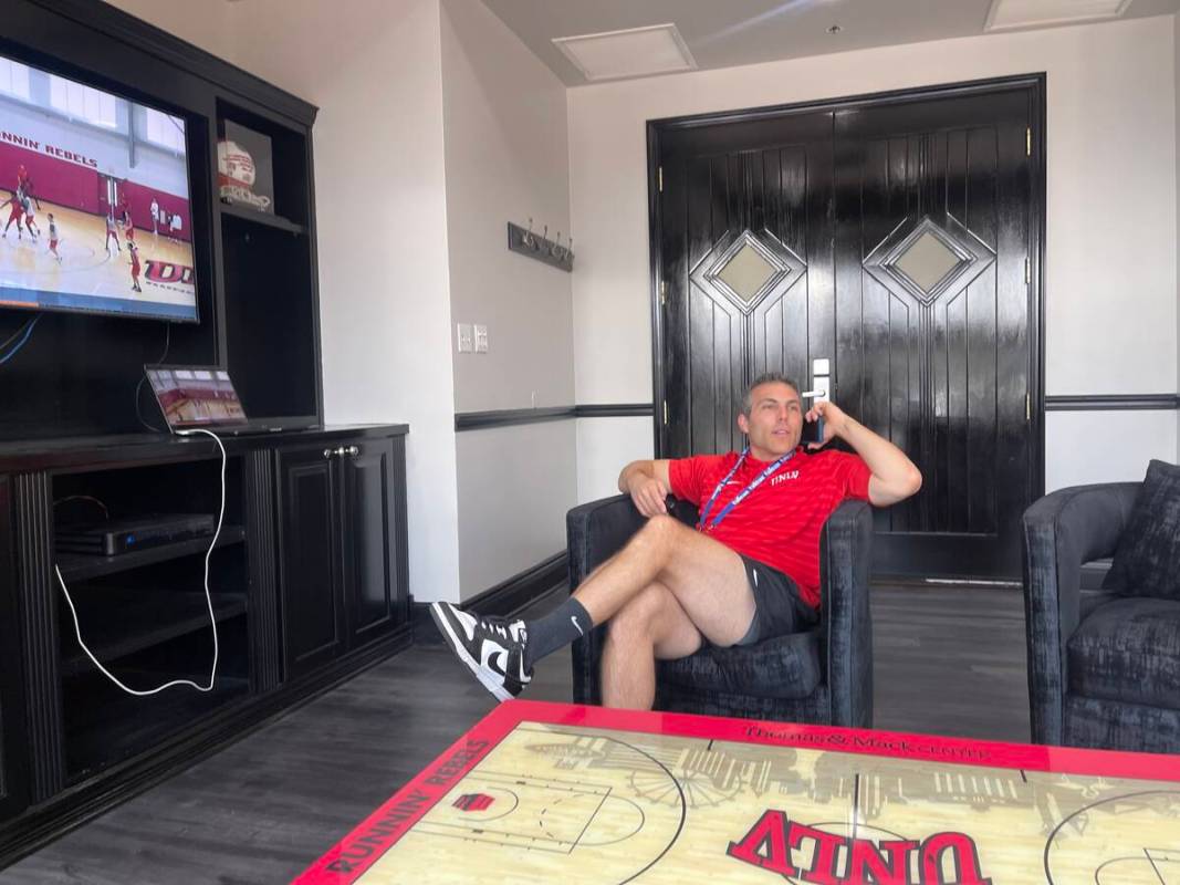 UNLV basketball coach Josh Pastner watches film in his office. (Callie Fin/Las Vegas Review-Jou ...