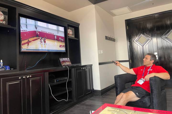 UNLV basketball coach Josh Pastner watches film in his office. (Callie Fin/Las Vegas Review-Jou ...