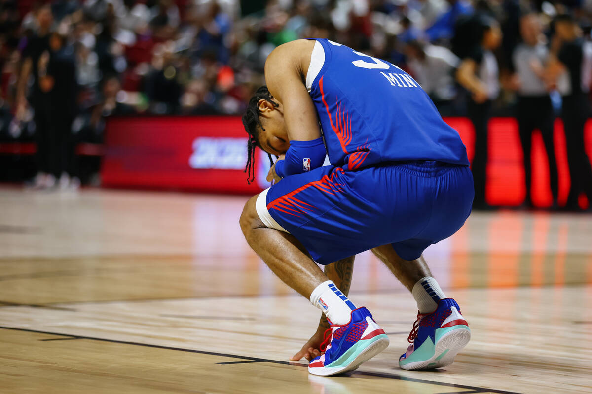 Philadelphia 76ers guard Judah Mintz (33) takes a quiet moment on the court before starting a g ...