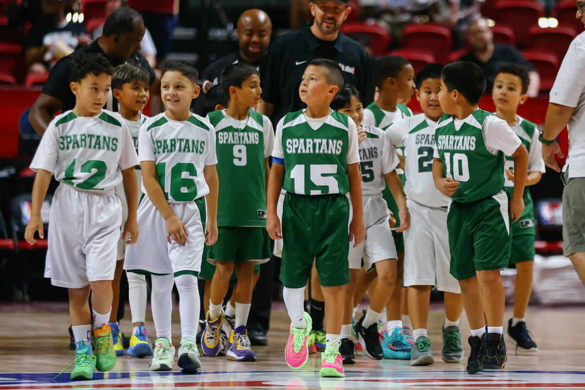 Members of Clark County’s Spartan Basketball Academy stand on the court after playing a ...