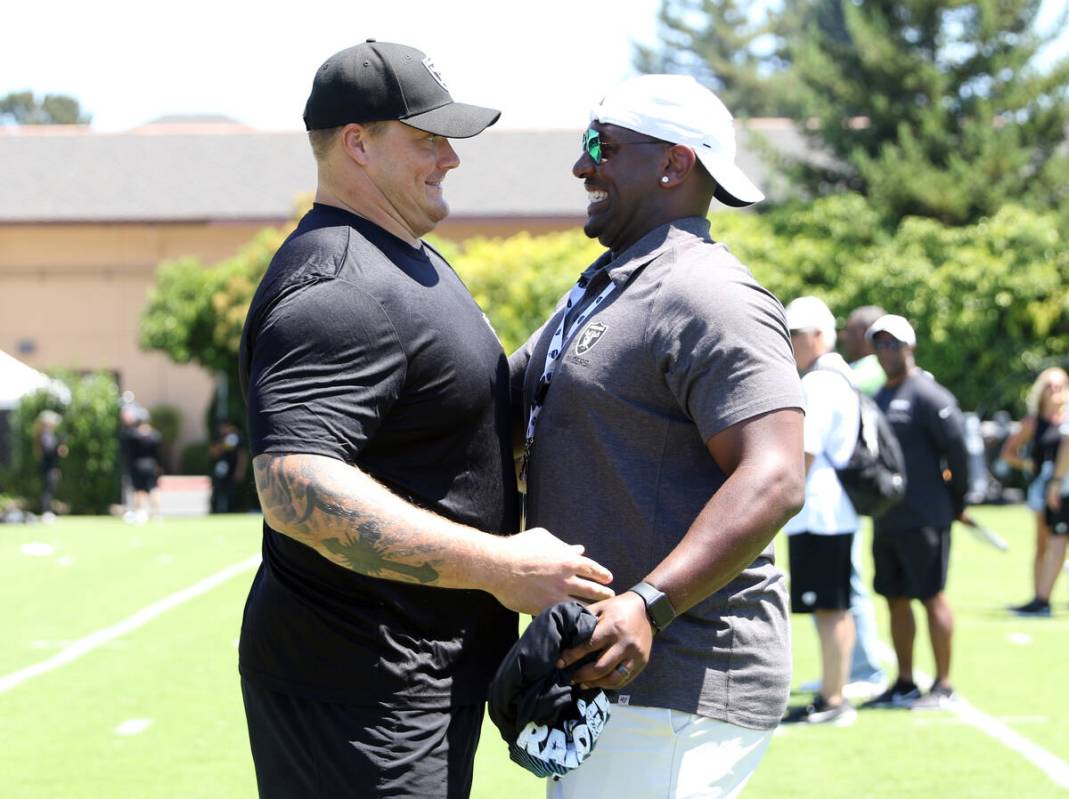 Oakland Raiders offensive guard Richie Incognito, left, greets former Raiders linebacker Kirk M ...