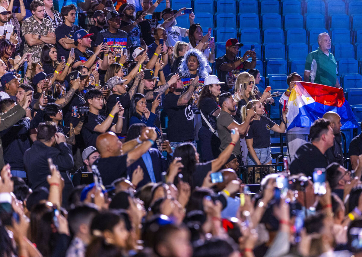 Fans look on in anticipation as WBC welterweight championship fighter Manny Pacquiao arrives du ...
